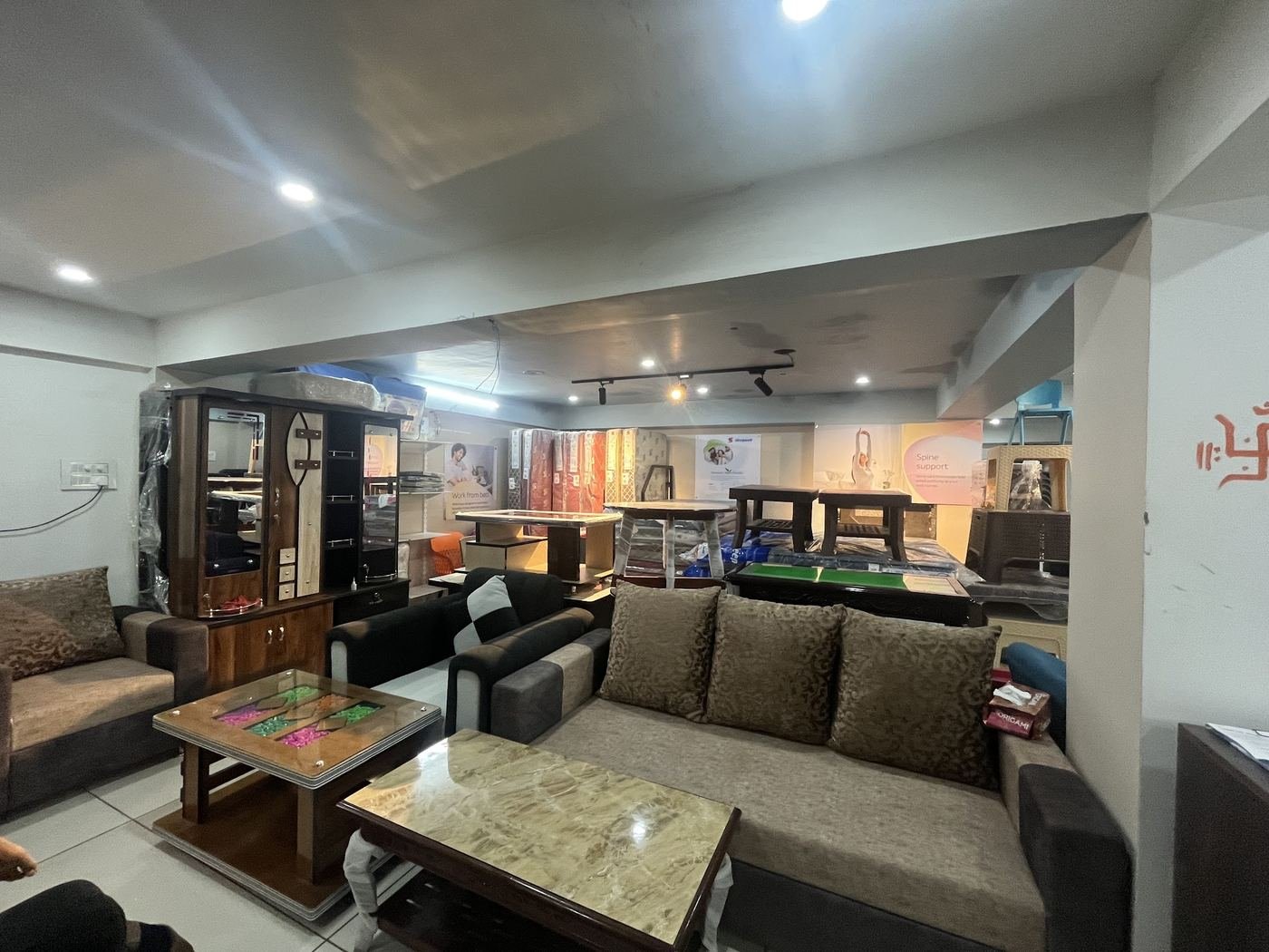 Inside Marudhar Furniture showroom: sofa sets, center tables, display cabinet and dining tables