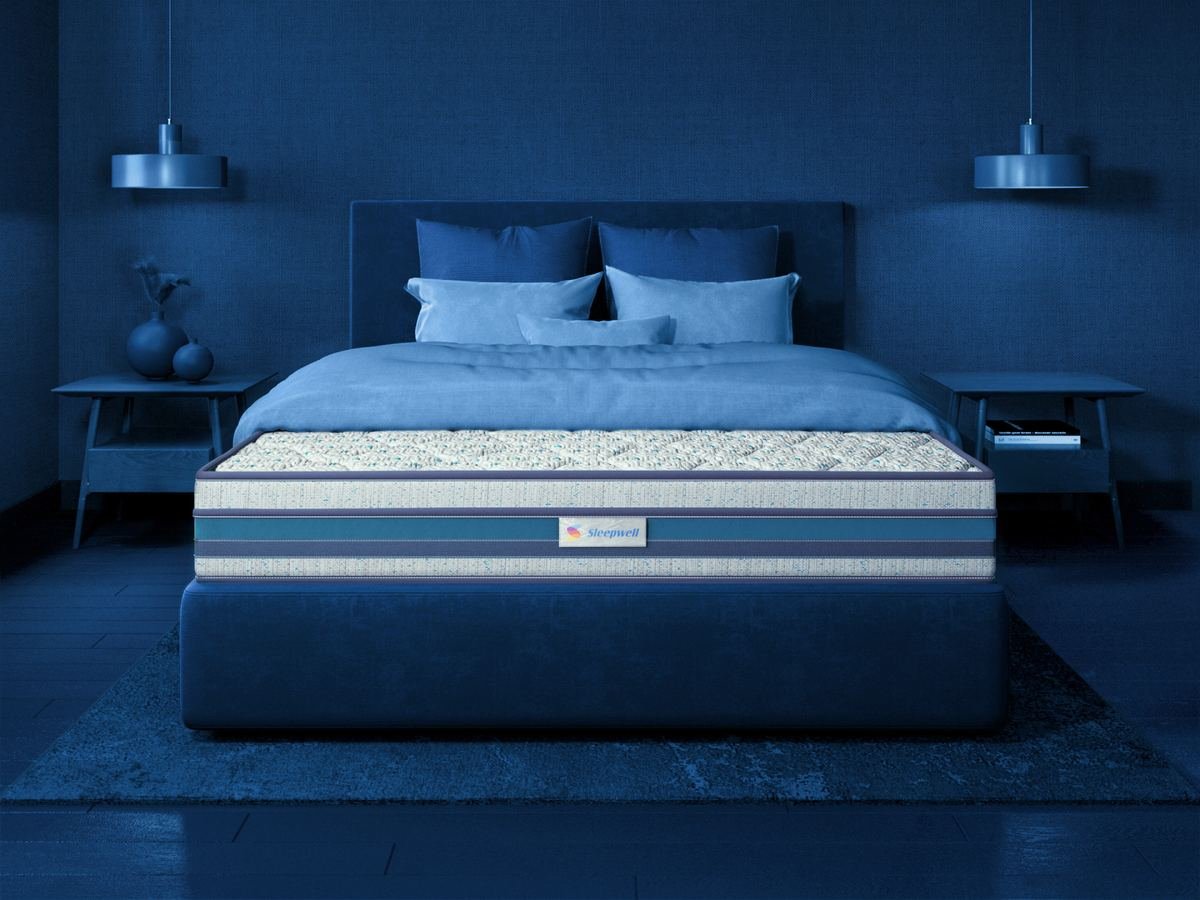 Sleepwell mattress on a bed — available at Sleepwell Shoppe, Marudhar Furniture Jodhpur