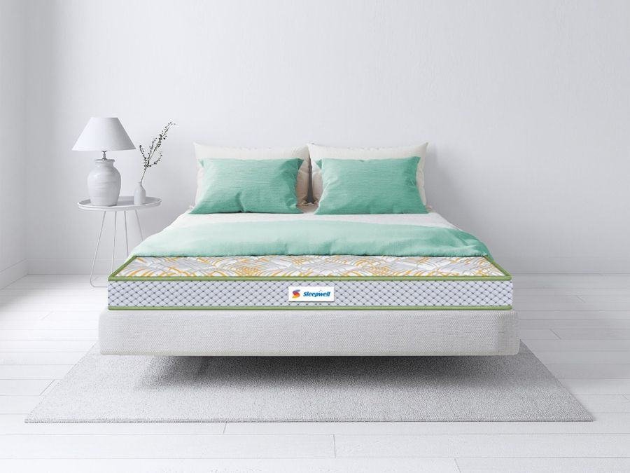 Sleepwell mattress on a bed — available at Sleepwell Shoppe, Marudhar Furniture Jodhpur